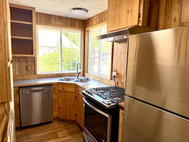3305 Bradeen Rd, Rice, WA 99167 - kitchen with stainless steel appliances, under cabinet range hood, wood finished floors, and light countertops