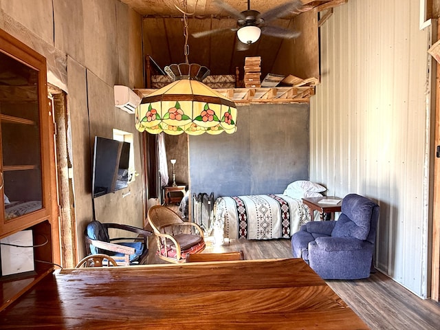 3305 Bradeen Rd, Rice, WA 99167 - bedroom featuring wood finished floors, wooden walls, and an AC wall unit