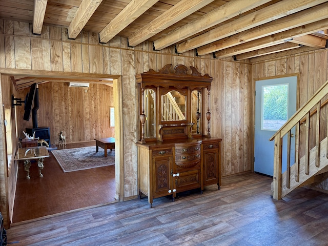 3305 Bradeen Rd, Rice, WA 99167 - foyer featuring a wood stove, stairway, wood finished floors, wooden walls, and a wood ceiling with exposed beams