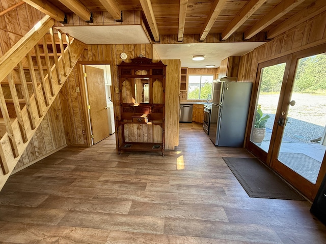 3305 Bradeen Rd, Rice, WA 99167 - kitchen with stainless steel appliances, wood walls, dark wood-type flooring, french doors, and a wood ceiling with exposed beams
