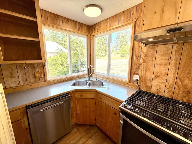 3305 Bradeen Rd, Rice, WA 99167 - kitchen featuring stainless steel dishwasher, range with gas stovetop, open shelves, light countertops, and light wood-type flooring