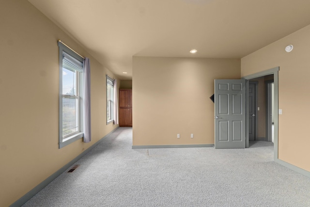 empty room featuring light colored carpet