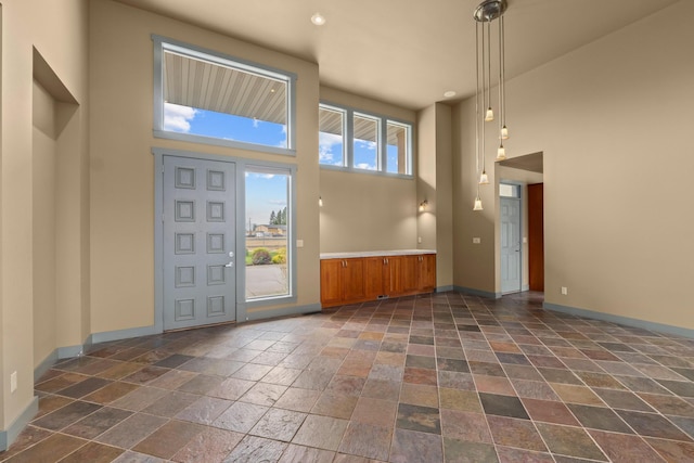 entrance foyer with a towering ceiling