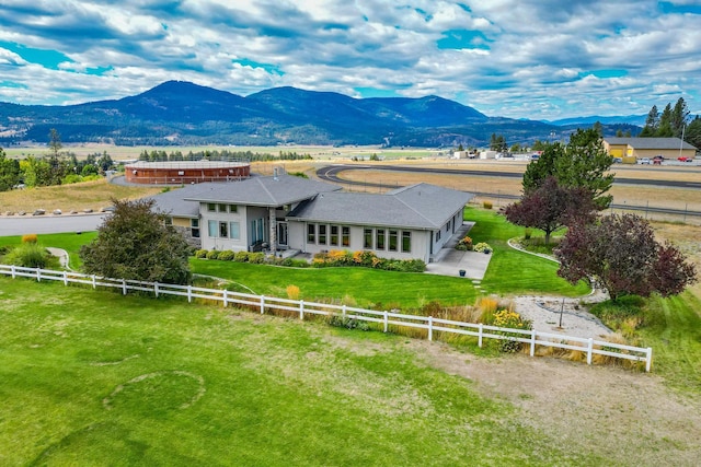 view of front of property featuring a mountain view and a rural view