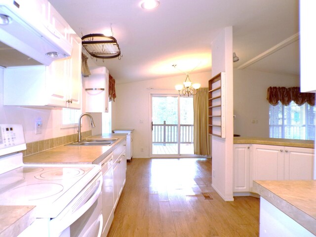 kitchen featuring white cabinetry, sink, white appliances, and exhaust hood