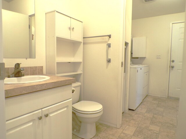 bathroom featuring toilet and vanity