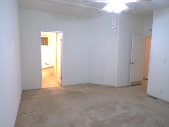 empty room with light carpet and ceiling fan