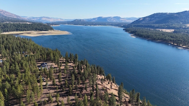 drone / aerial view with a water and mountain view