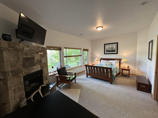 2122 Northport Flat Creek Rd, Kettle Falls, WA 99141 - carpeted bedroom featuring baseboards and a stone fireplace