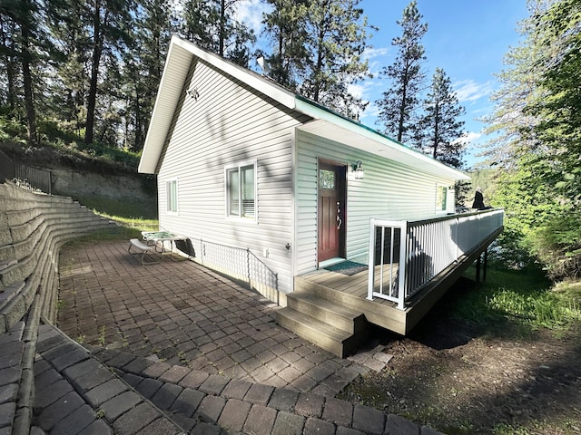 2122 Northport Flat Creek Rd, Kettle Falls, WA 99141 - rear view of property featuring a wooden deck and a patio area