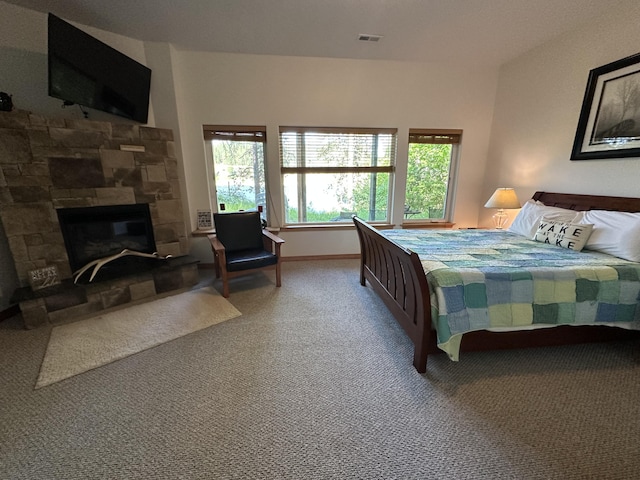 2122 Northport Flat Creek Rd, Kettle Falls, WA 99141 - bedroom with carpet flooring, a fireplace, and baseboards
