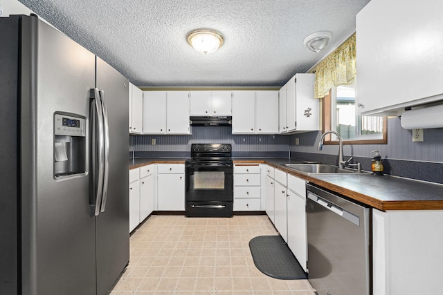 505 W Court Ave, Chewelah, WA 99109 - kitchen featuring appliances with stainless steel finishes, under cabinet range hood, a sink, dark countertops, and a textured ceiling