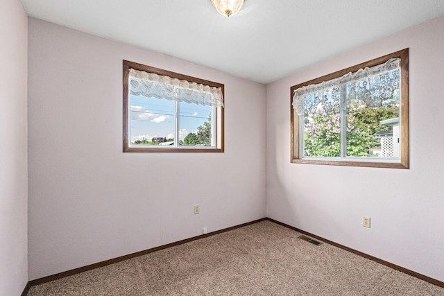 505 W Court Ave, Chewelah, WA 99109 - unfurnished room with baseboards and light colored carpet