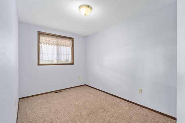 505 W Court Ave, Chewelah, WA 99109 - unfurnished room featuring light colored carpet and baseboards