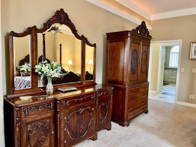 interior details with ornamental molding and carpet flooring