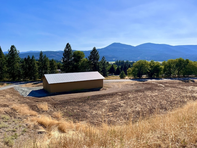 mountain view featuring a rural view