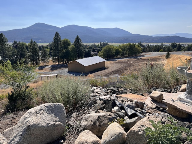 property view of mountains featuring a rural view