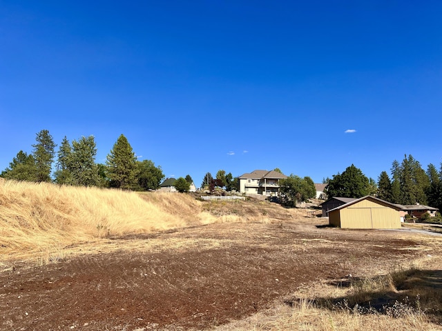 view of yard with a rural view