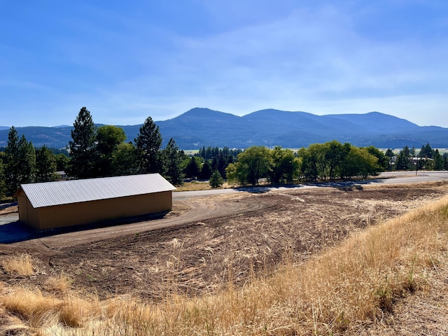 property view of mountains featuring a rural view