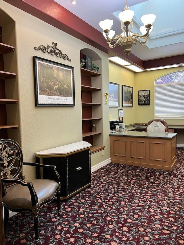 office featuring built in features and an inviting chandelier