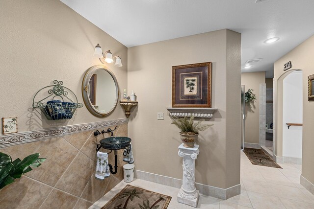 bathroom with tile patterned floors