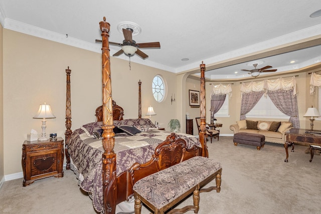 carpeted bedroom featuring ceiling fan and ornamental molding