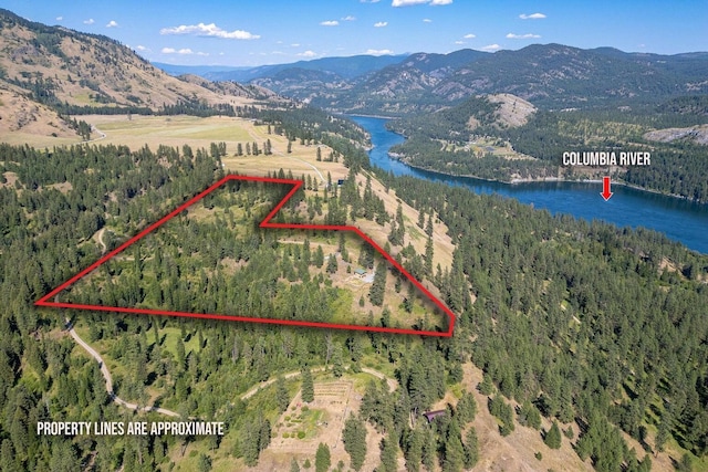 3705 Hope Way, Kettle Falls, WA 99141 - aerial overview of property's location with a water and mountain view, a forest, and property parcel outlined