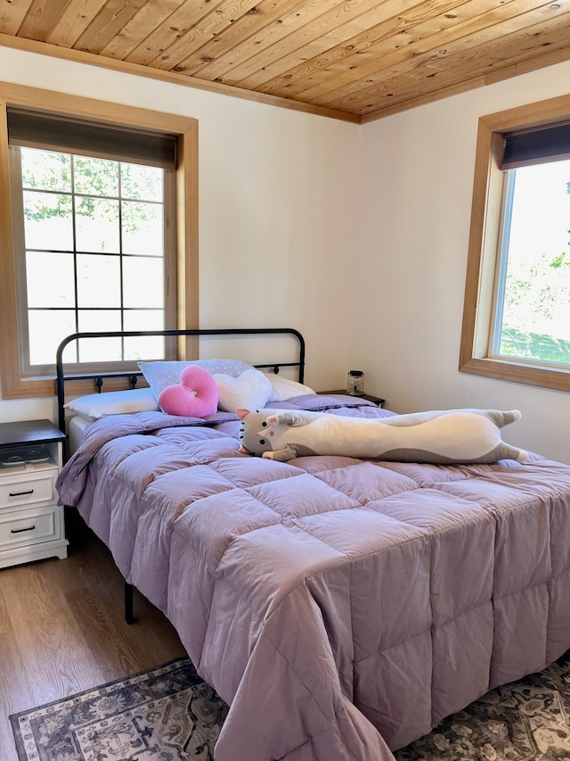 3705 Hope Way, Kettle Falls, WA 99141 - bedroom featuring wooden ceiling, multiple windows, wood finished floors, and crown molding