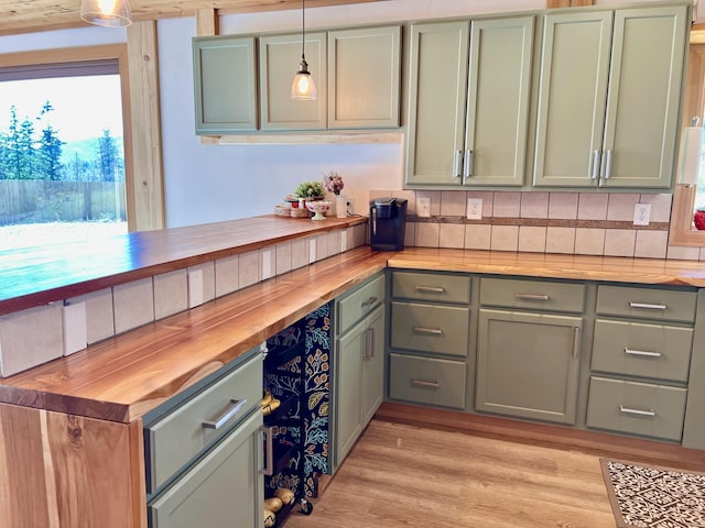 3705 Hope Way, Kettle Falls, WA 99141 - kitchen featuring wood counters, green cabinets, and hanging light fixtures
