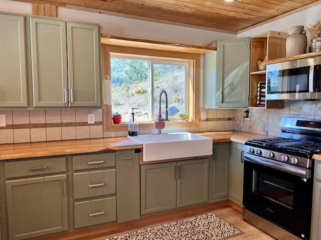 3705 Hope Way, Kettle Falls, WA 99141 - kitchen with appliances with stainless steel finishes, wood ceiling, gray cabinetry, a sink, and backsplash