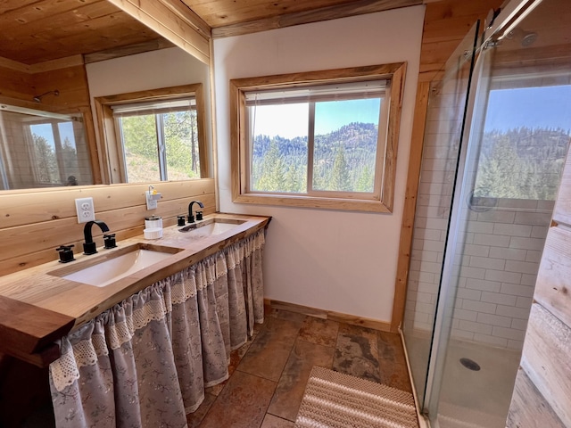 3705 Hope Way, Kettle Falls, WA 99141 - bathroom featuring wooden ceiling, a stall shower, double vanity, and baseboards