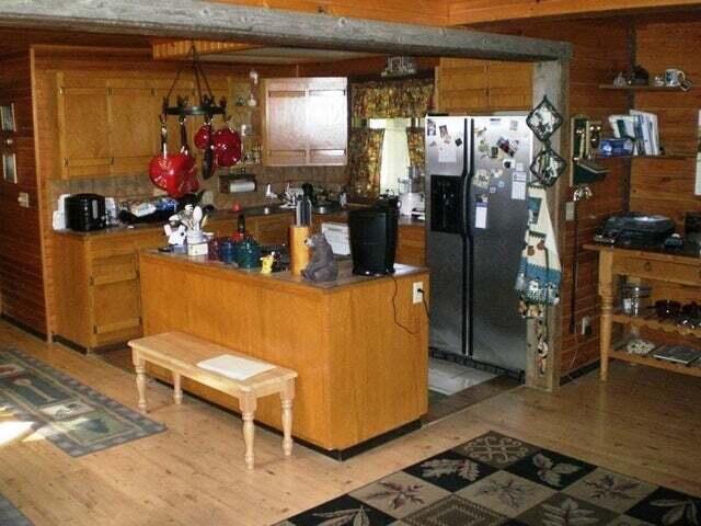 kitchen featuring light wood-type flooring and stainless steel fridge with ice dispenser