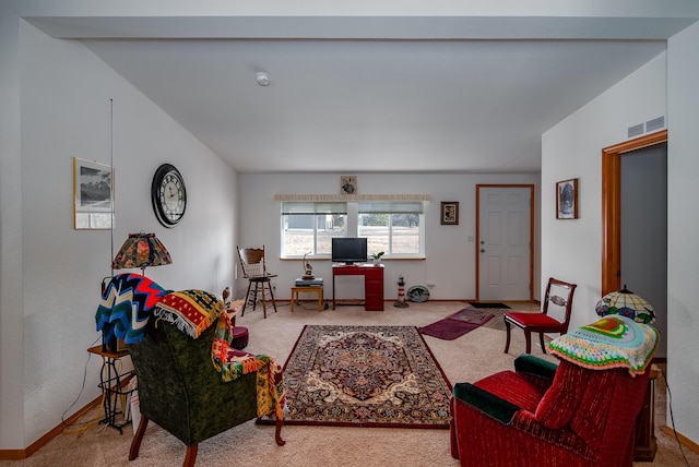 carpeted living room featuring vaulted ceiling