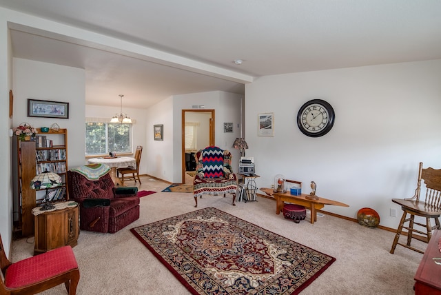 carpeted living room featuring a chandelier and beam ceiling