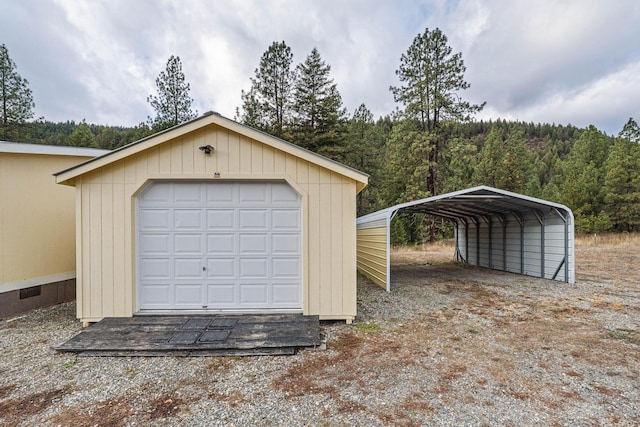 garage featuring a carport