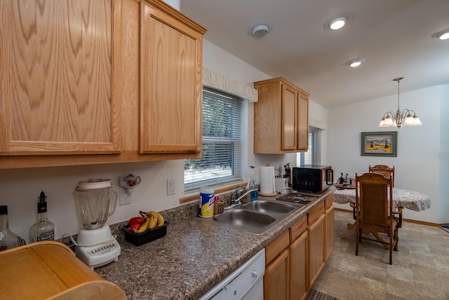 kitchen featuring sink, pendant lighting, and light brown cabinetry