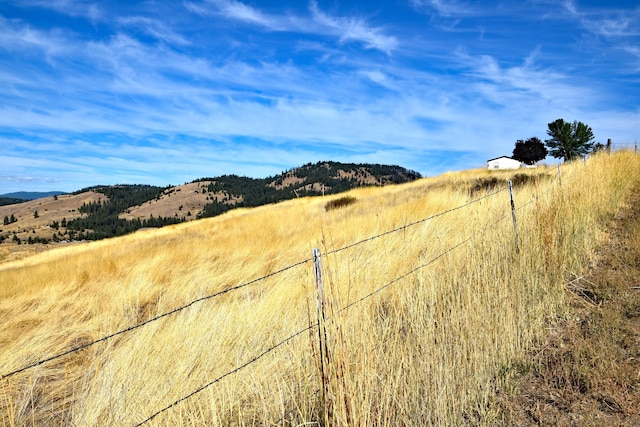 view of mountain feature with a rural view