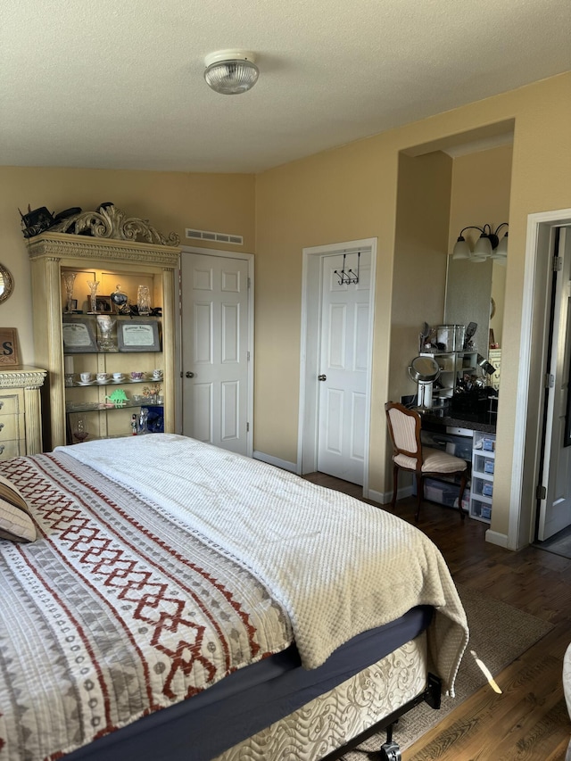 bedroom featuring dark hardwood / wood-style floors