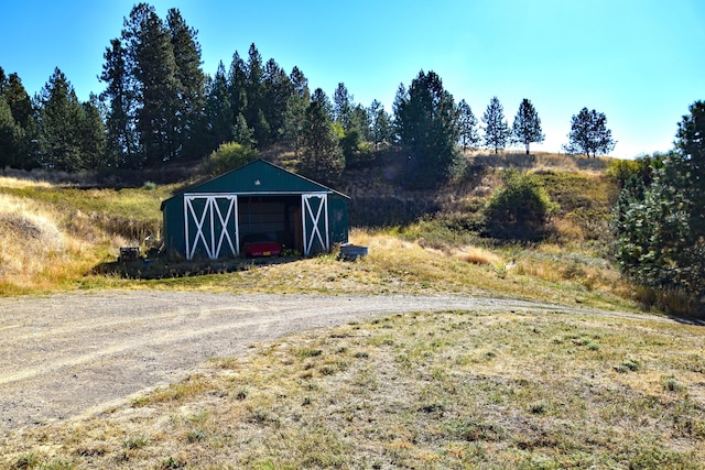 view of outbuilding with a rural view