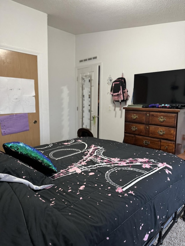 bedroom featuring a textured ceiling