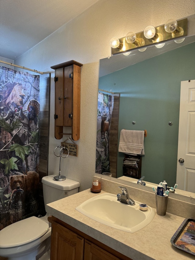 bathroom featuring lofted ceiling, toilet, a shower with shower curtain, and vanity