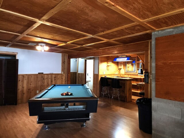 rec room with wooden ceiling, coffered ceiling, and bar area