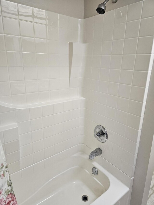 bathroom with shower / bath combo