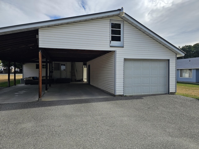 garage featuring a carport