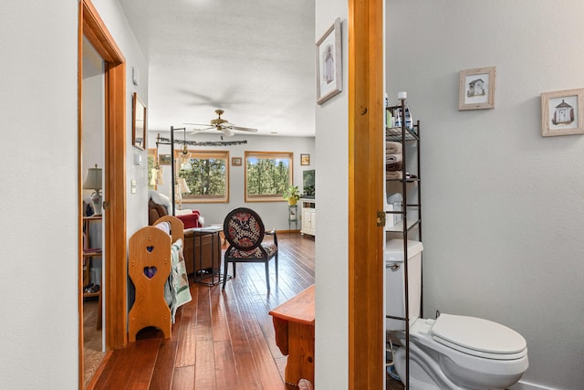 corridor with hardwood / wood-style floors