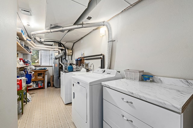 laundry area with cabinet space, visible vents, and washing machine and dryer