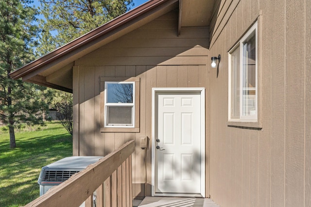 doorway to property featuring a yard