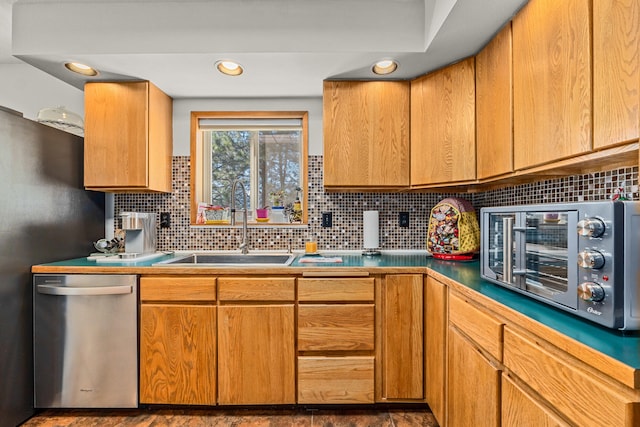 kitchen with a sink, recessed lighting, stainless steel dishwasher, a toaster, and decorative backsplash