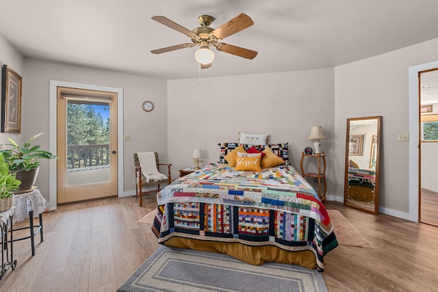 bedroom featuring ceiling fan, access to outside, baseboards, and wood finished floors