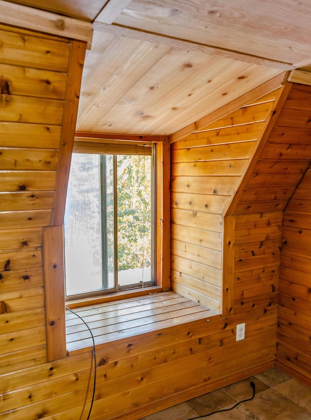 bonus room featuring wooden walls, wood ceiling, and a sauna